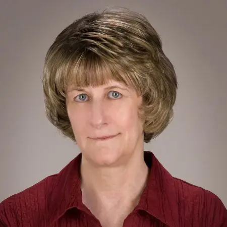 A woman with short hair and wearing a red shirt.